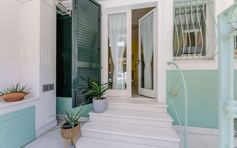 Suite Oltremare: Plant, Flowerpot, Houseplant, Building, Azure, Stairs, Interior Design, Door, Wood, Floor