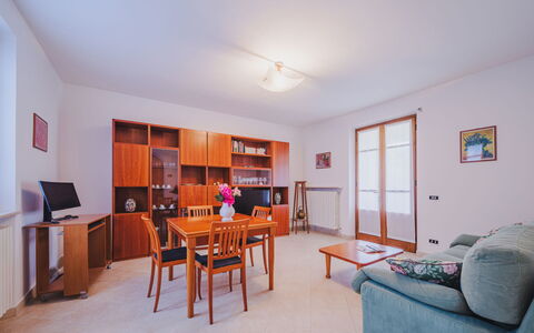 Villa Giuliana: Table, Furniture, Picture Frame, Bookcase, Shelving, Wood, Orange, Couch, Interior Design, Living Room