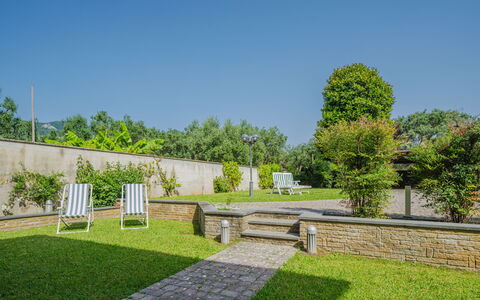 Villa Giuliana: Sky, Plant, Tree, Land Lot, Vegetation, Grass, Road Surface, Urban Design, Shrub, Landscape