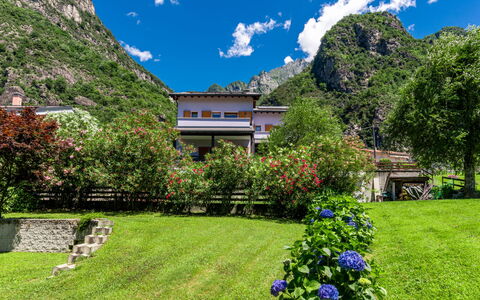 Angelina House: Plant, Sky, Cloud, Property, Building, Blue, Nature, Azure, Flower, Natural Landscape