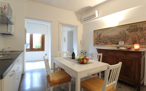 Comfort Apartment, Welness, Terrace: Furniture, Property, Table, Cabinetry, Picture Frame, Chair, Wood, Interior Design, Flooring, Floor