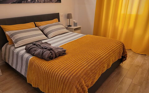 Comfort Apartment, Welness, Terrace: Furniture, Bed, Bedroom, Bedding, Interior Design, Bed Sheet, Yellow, Linens, Wood, Floor