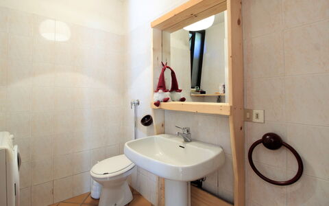 Baita a Pieve Tesino Mountain And Lake: Mirror, Tap, Bathroom Sink, Sink, Plumbing Fixture, Property, Bathroom, Purple, Interior Design, Building
