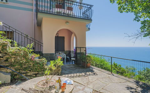 La Ginestra: Plant, Building, Water, Sky, Window, Flowerpot, Land Lot, Door, Cottage, Chair