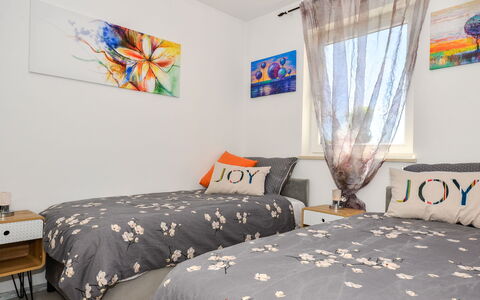 Kiki: Property, Furniture, Window, Building, Textile, Comfort, Interior Design, Shade, Floor, Bed