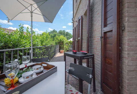 Torri 15 Holiday Home: Sky, Building, Property, Table, Furniture, Cloud, Tableware, Window, Architecture, Flowerpot