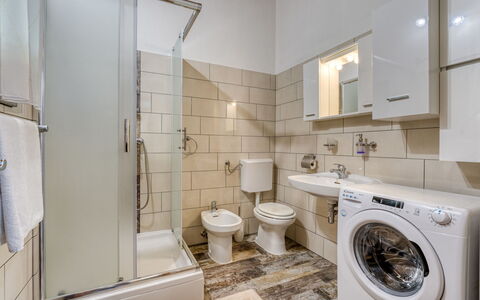 Zora: Laundry Room, Washing Machine, Plumbing Fixture, Clothes Dryer, Mirror, Bathroom, Interior Design, Flooring, Floor, Line