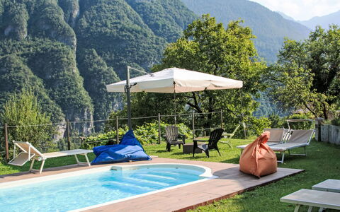 La Meridiana: Water, Mountain, Swimming Pool, Plant, Green, Tree, Shade, Sky, Outdoor Furniture, Cloud