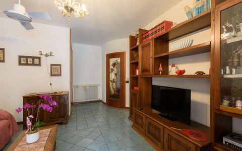 Le Rose di Rosanna: Property, Shelf, Cabinetry, Picture Frame, Wood, Living Room, Interior Design, Lighting, Television, Flooring