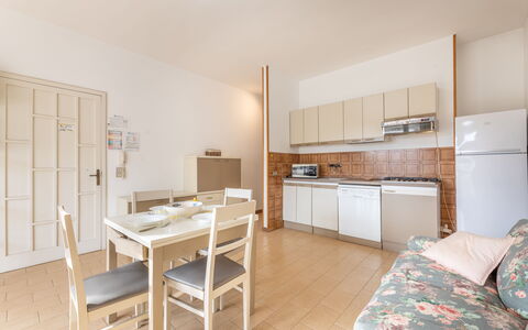 Apartment Living In Baia Verde - Gallipoli: Furniture, Cabinetry, Countertop, Table, Building, Kitchen, Chair, Wood, Flooring, Floor
