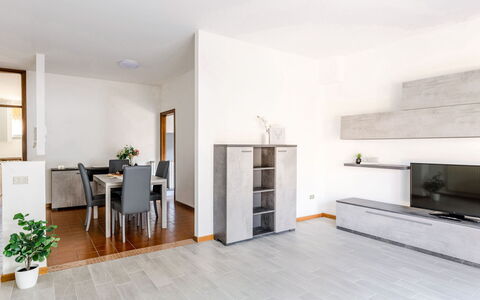 Fano Suite Apartment: Plant, Furniture, Flowerpot, Wood, Chair, Houseplant, Living Room, Door, Floor