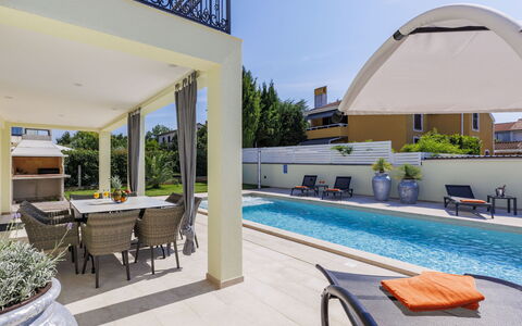 Kalina: Plant, Water, Furniture, Property, Sky, Shade, Swimming Pool, Outdoor Furniture, Flowerpot, Lighting