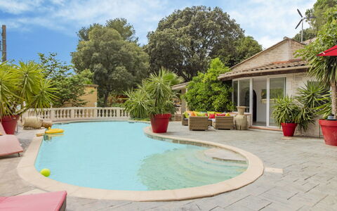 Villa du Soleil: Water, Sky, Plant, Cloud, Building, Azure, Swimming Pool, Tree, Flowerpot, House