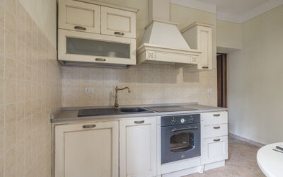 Arpusè - Ca Renato Grane' Apartment with Pool: Kitchen, Cabinetry, Kitchen Appliance, Countertop, Major Appliance, Flooring, Wood, Interior Design, Floor, Furniture