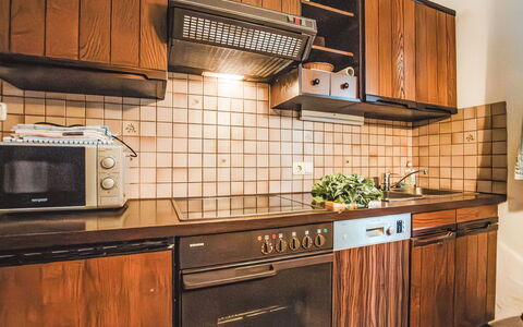 Bad Hofgastein 160: Wood, Kitchen, Interior Design, Flooring, Brown, Countertop, Kitchen Stove, Cabinetry, Kitchen Appliance, Wood Stain