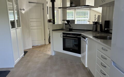 Enida - 350M to the Fjord: Flooring, Kitchen, Kitchen Appliance, Countertop, Interior Design, Floor, Major Appliance, Ceiling, Cabinetry, Furniture