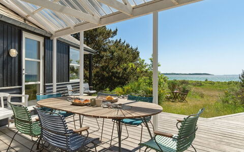 Klint - 25M from the Sea: Roof, Home, Door, Cottage, Shade, Siding, Yard, Estate, Backyard