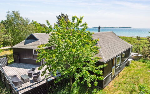 Klint - 25M from the Sea: Roof, Home, Door, Cottage, Shade, Siding, Yard, Estate, Backyard