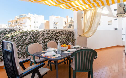 Happy House: Furniture, Floor, Interior Design, Chair, Apartment, Outdoor Furniture, Balcony, Awning, Resort, Shade