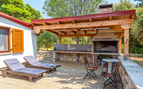 Dundo House: Wood, Furniture, Outdoor Furniture, Wood Stain, Chair, Shade, Outdoor Table, Outdoor Structure, Garden, Patio