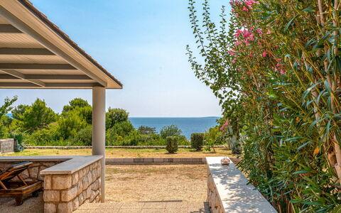 Dundo House: Shade, Column, Garden, Landscaping, Outdoor Structure, Wood Stain, Design, Outdoor Furniture, Pergola, Backyard