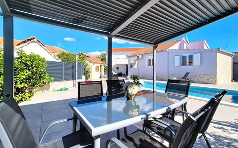 Nancy: Furniture, Shade, Outdoor Furniture, Composite Material, Chair, Awning, Patio, Outdoor Structure, Deck, Swimming Pool