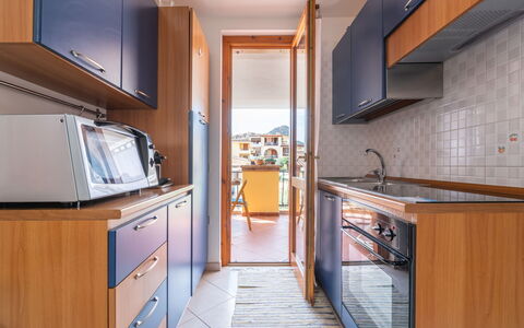 Vanda: Cabinetry, Furniture, Countertop, Lighting, Wood, Kitchen, Interior Design, Architecture, Building, Floor