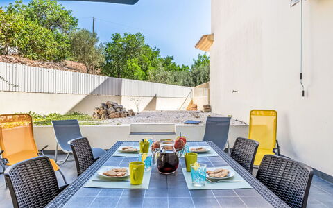 Vila Parra: Table, Furniture, Tableware, Property, Sky, Food, Chair, Couch, Azure, Outdoor Furniture