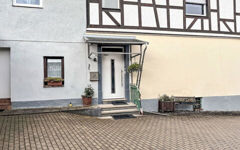 Adenau 385: Building, Window, Plant, Road Surface, Lighting, Wood, Flowerpot, Urban Design, Door, Flooring