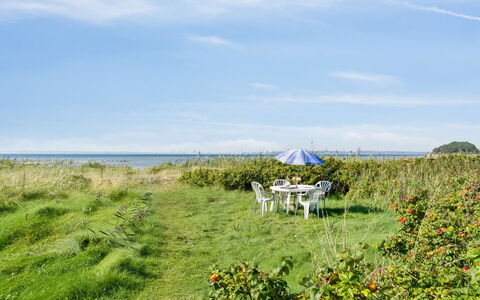 Joella - 75M from the Sea: Roof, House, Home, Cottage, Siding, Estate, Driveway, Garden Buildings, Yard, Shed