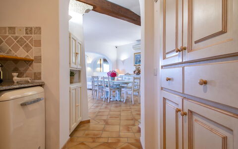 Smeralda: Cabinetry, Furniture, Wood, Kitchen, Countertop, Architecture, Gas Stove, Interior Design, Chair, Floor