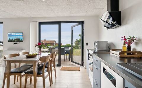 Rico - 50M from the Sea: Furniture, Flooring, Floor, Kitchen & Dining Room Table, Ceiling, Countertop, Chair, Kitchen, Hardwood, Houseplant