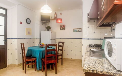 Surfers Inn: Furniture, Table, Property, Cabinetry, Building, Chair, Lighting, Wood, Interior Design, Door