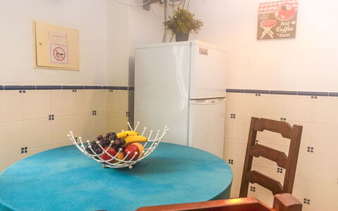 Surfers Inn: Furniture, Table, Building, Interior Design, Lighting, Plant, Chair, Houseplant, Clock, Flooring