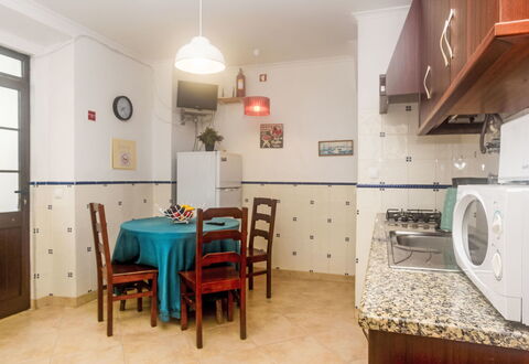 Surfers Inn: Furniture, Table, Property, Cabinetry, Building, Chair, Lighting, Wood, Interior Design, Door