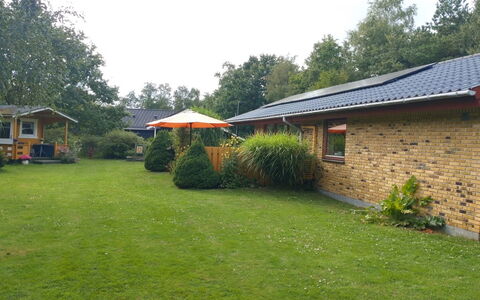 Kasper - 700M from the Sea: Roof, House, Home, Cottage, Siding, Estate, Driveway, Garden Buildings, Yard, Shed