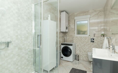 Six Brothers: Plumbing Fixture, Shower Door, Mirror, Bathroom, House, Window, Building, Floor, Laundry Room