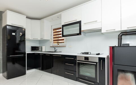 Six Brothers: Cabinetry, Countertop, Furniture, Kitchen Stove, Building, Kitchen Appliance, Tap, Home Appliance, Kitchen, Wood
