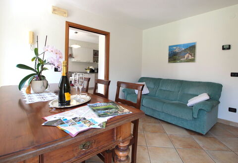 Apartment With Garden, Del Corlo Lake, Belluno: Table, Furniture, Picture Frame, Property, Plant, Couch, Green, Flower, Interior Design, Wood