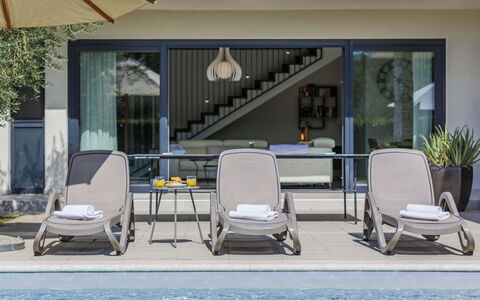 Bianca: Water, Property, Plant, Furniture, Shade, Chair, Outdoor Furniture, Interior Design, Swimming Pool, Building