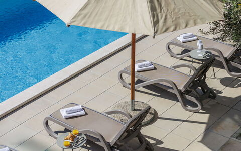 Bianca: Water, Outdoor Furniture, Shade, Umbrella, Table, Floor, Urban Design, Leisure, Sunlounger, Building
