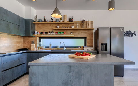 Bianca: Countertop, Cabinetry, Kitchen, Tap, Wood, Kitchen Stove, Interior Design, Lighting, Sink, Flooring