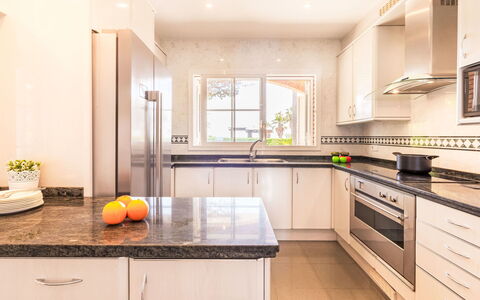 Luxury B: Cabinetry, Countertop, Property, Kitchen Sink, Kitchen Stove, Kitchen, Kitchen Appliance, Wood, Home Appliance, Lighting