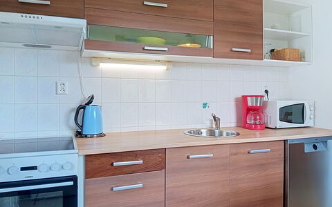 Green Valley Park Stárkov 3: Cabinetry, Countertop, Flooring, Wood, Furniture, Interior Design, Kitchen Appliance, Kitchen, Major Appliance, Floor