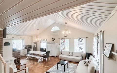 Tyttelsson: Interior Design, Furniture, Ceiling, Wood, Flooring, Couch, Floor, Living Room, Light Fixture, Home
