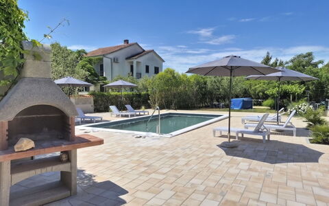 Aria: Outdoor Furniture, Furniture, Flagstone, Shade, Composite Material, Chair, Swimming Pool, Umbrella, Tile, Garden