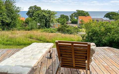 Ågot - 350M from the Sea: Sky, Furniture, Wood, Outdoor Furniture, Chair, Deck, Hardwood, Outdoor Table, Shade, Wood Stain