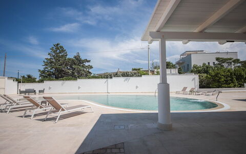 Villa Azzurra Seaview In Monopoli, Puglia: Water, Sky, Cloud, Plant, Swimming Pool, Tree, Shade, Leisure, Composite Material, Landscape