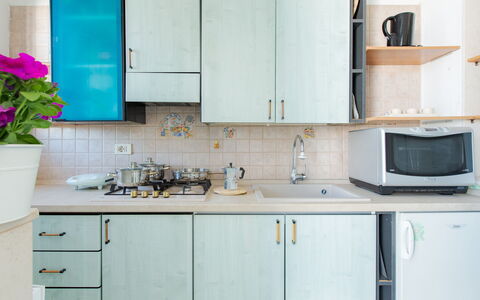 Casa Laura: Blue, Kitchen, Kitchen Appliance, Countertop, Major Appliance, Wood, Cabinetry, Flooring, Kitchen Sink, Interior Design