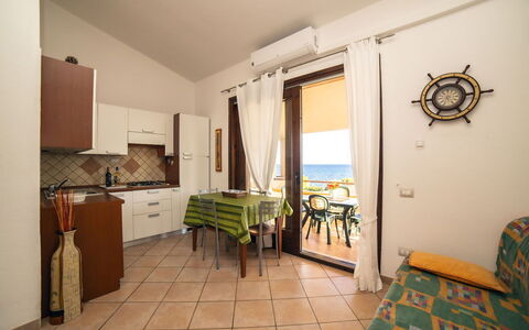 Trilocale Apartments Seaside: Furniture, Flooring, Floor, Interior Design, Chair, Sea, Table, Kitchen & Dining Room Table, Wood Stain, Ocean